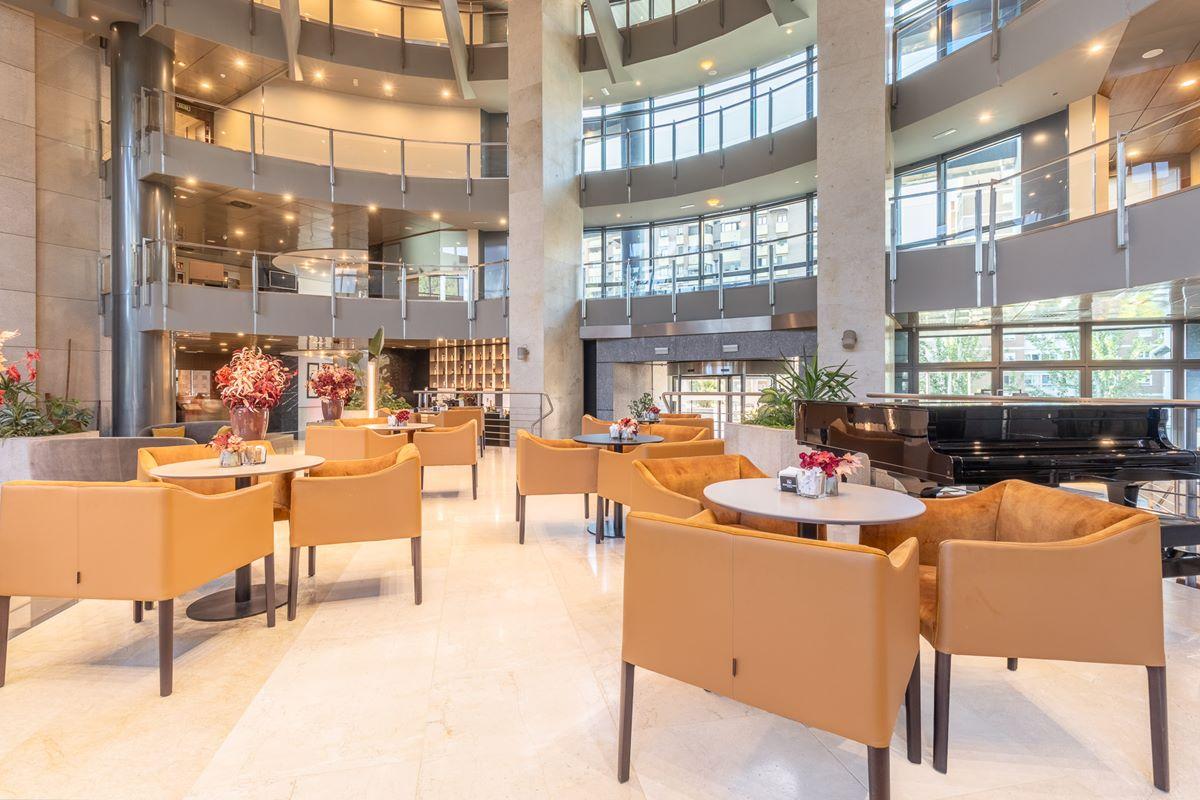 Eurostars Suites Mirasierra Madrid Exterior photo The lounge at the airport