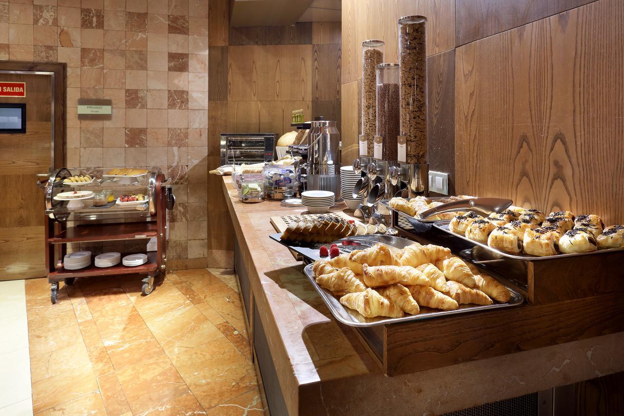 Eurostars Suites Mirasierra Madrid Exterior photo A breakfast buffet at a hotel