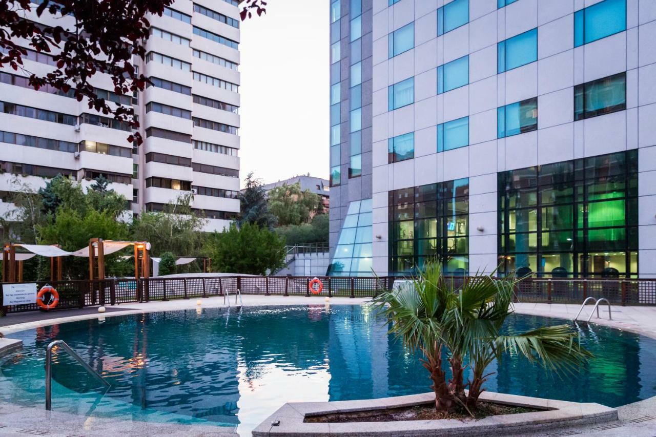 Eurostars Suites Mirasierra Madrid Exterior photo The pool at the hotel